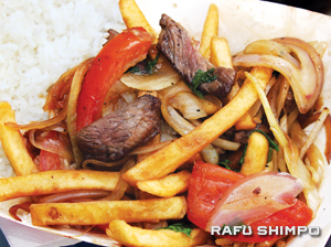 saltado copy Lomo Saltado—marinated beef, stir-fried with sliced tomatoes, onions, and potatoes.